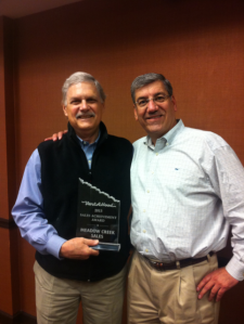 Dick Baur, Meadow Creek Sales, accepts the 2013 Vent-A-Hood Sales Award from Mark Klein, Director of Sales at Vent-A-Hood.